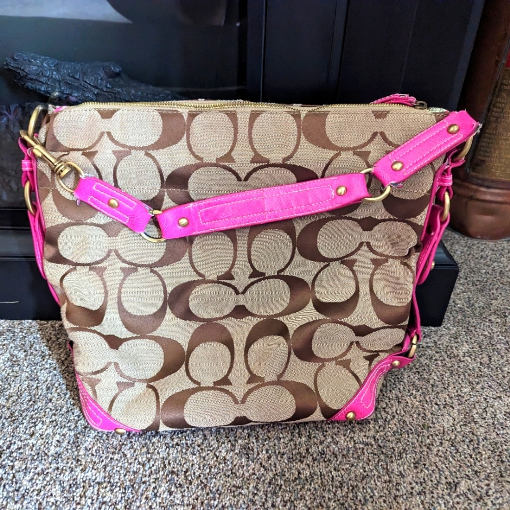 Coach purse with pink leather strapping